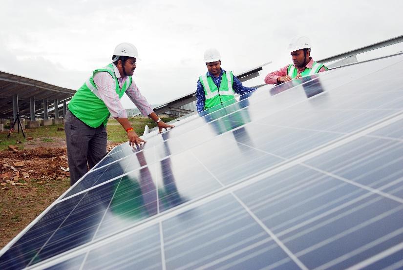 Avaada team working at solar energy power plant